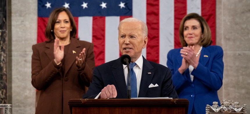 US President Joe Biden delivers the State of the Union address as U.S. Vice President Kamala Harris (L) and House Speaker Nancy Pelosi (D-CA) applaud during a joint session of Congress in the U.S. Capitol House Chamber on March 1, 2022 in Washington, DC. 