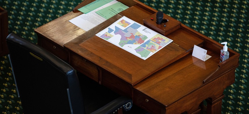 A map of state Senate districts is seen on a desk in the Senate chamber on the first day of the 87th Legislature's third special session at the State Capitol on September 20, 2021 in Austin, Texas.