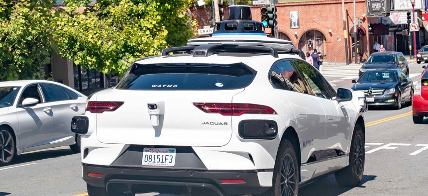 Self-driving car from Waymo and Jaguar, I-Pace, driving in traffic in San Francisco, California, in June 2021.