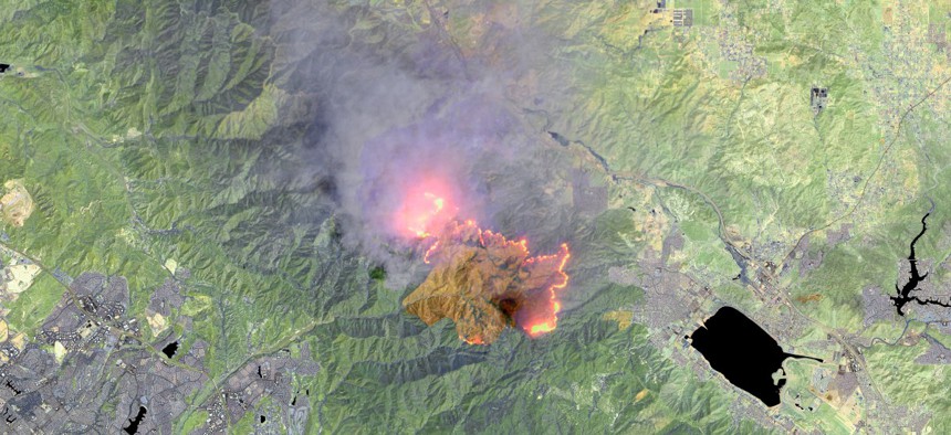 This is an enhanced Landsat-8 thermal satellite image of the Holy Fire, in Orange County, east of Long Beach, California.