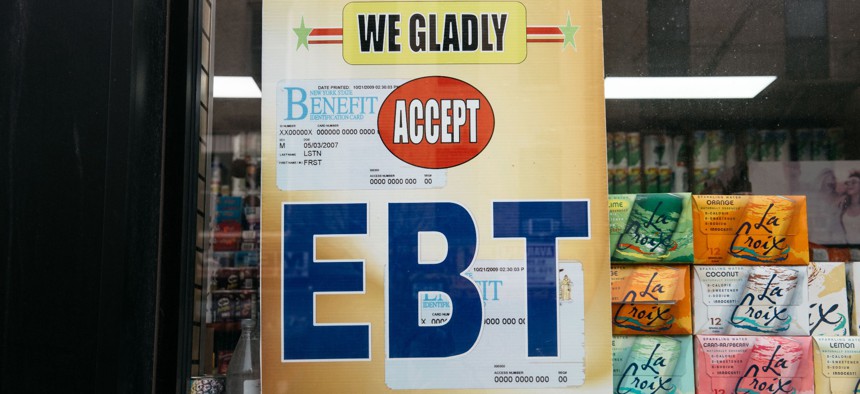  A sign alerting customers about SNAP food stamps benefits is displayed at a Brooklyn grocery store on December 5, 2019 in New York City. 