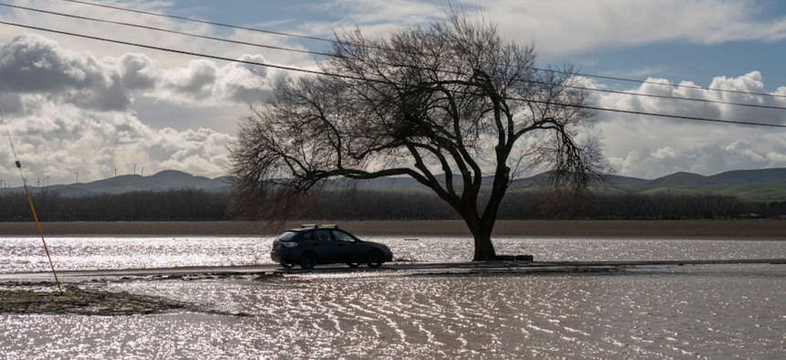 A car moves in flood water on January 16, 2023 in Contra Costa County, California.