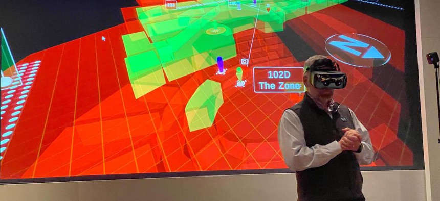 Dereck Orr, head of Public Safety Communications Research at NIST, trying out a virtual incident response dashboard at the CommanDING Tech Challenge event.